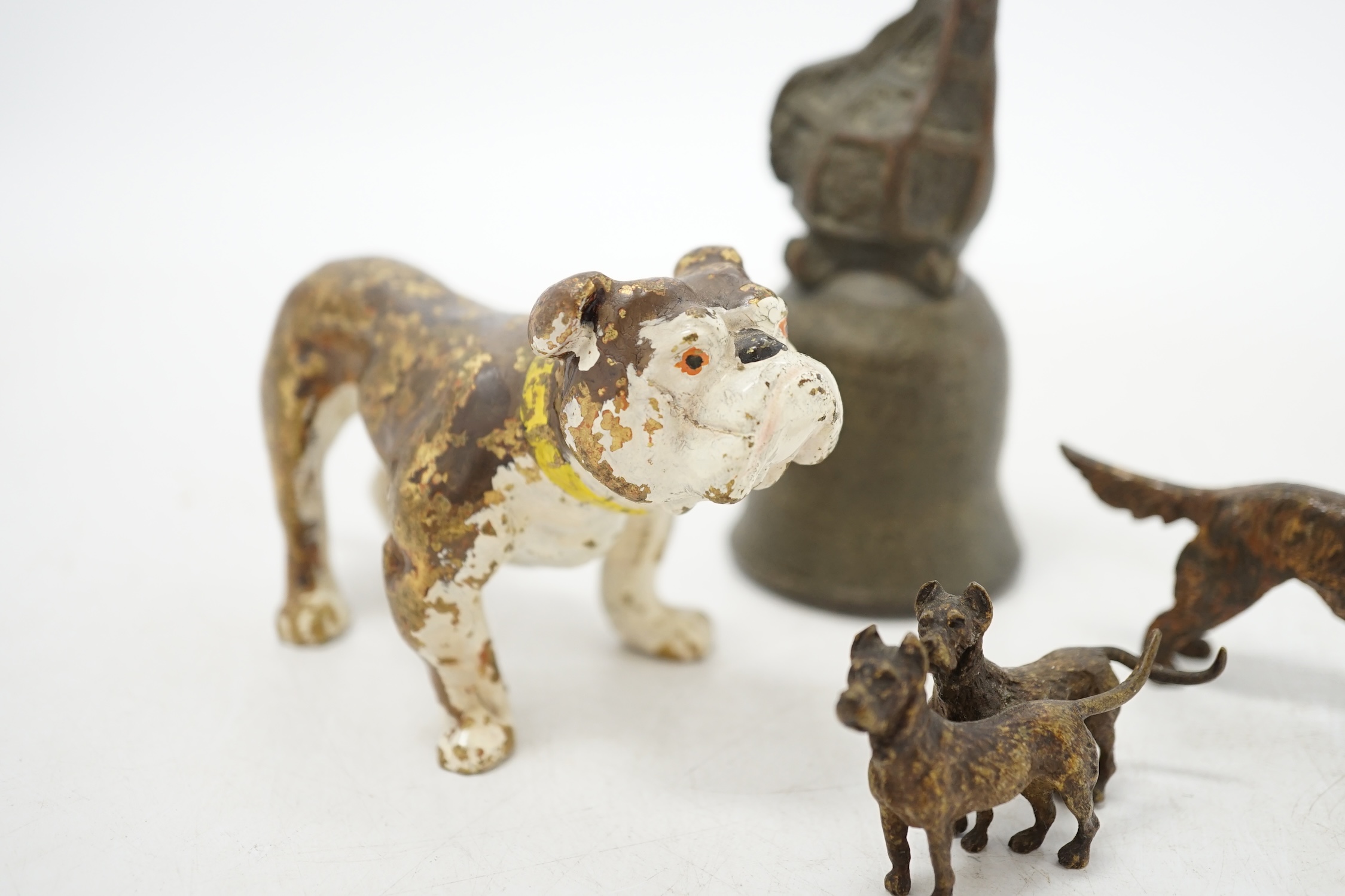 Three cold painted bronze dogs and a bronze giraffe handled bell, bell 13.5cm high. Condition - fair